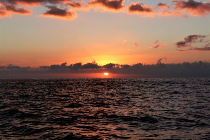 a sunset over a body of water